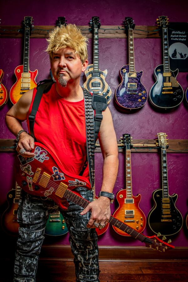 Adam DeGraide with a guitar