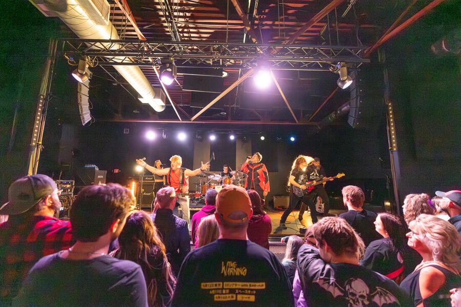 AMP live, reaching into the crowd