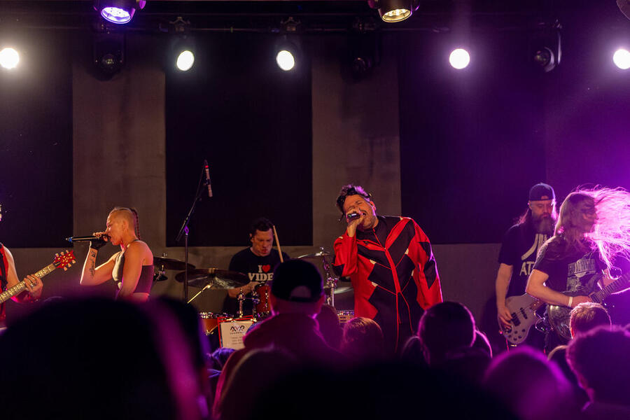 Mid-range shot of the full band
